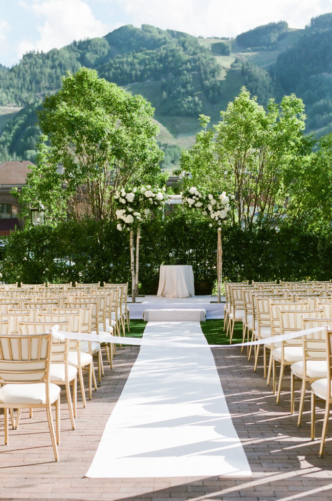 Mountain-Wedding-Venues-in-Colorado ceremony with mountain views in the background - Mountain Wedding Venues in Colorado