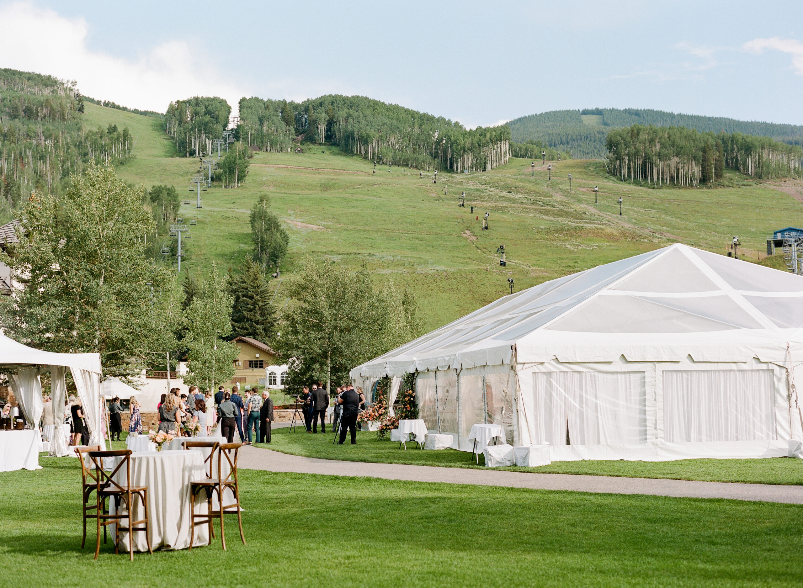 tented wedding with green hills in the background