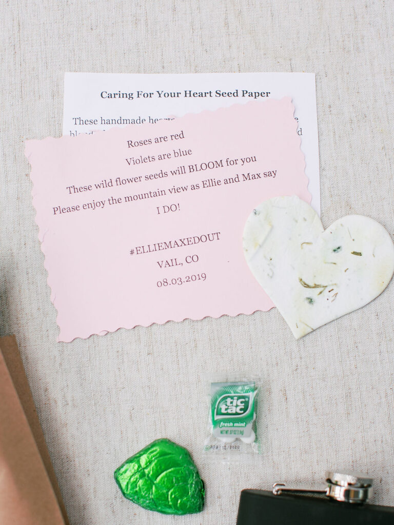 Pink wedding favor card with poem and heart-shaped seed paper for guests to plant wildflowers.