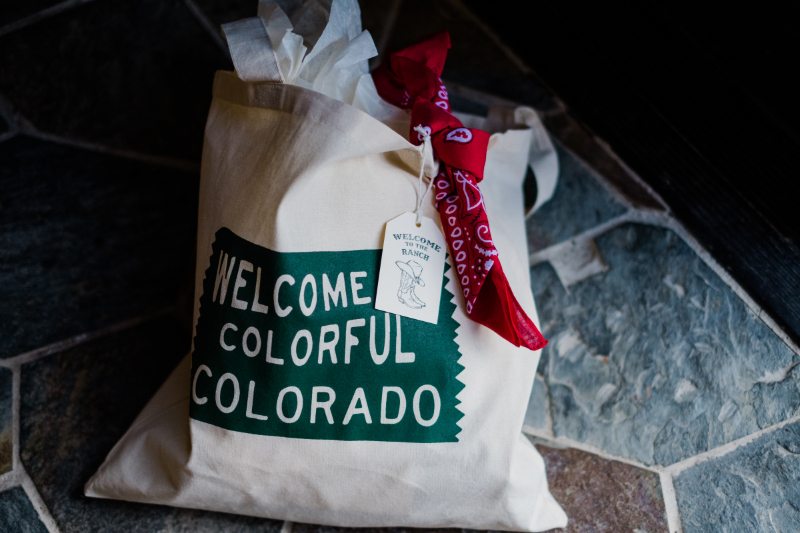 Colorado-themed wedding welcome bag with custom tag and bandana, enhancing the guest experience from arrival.