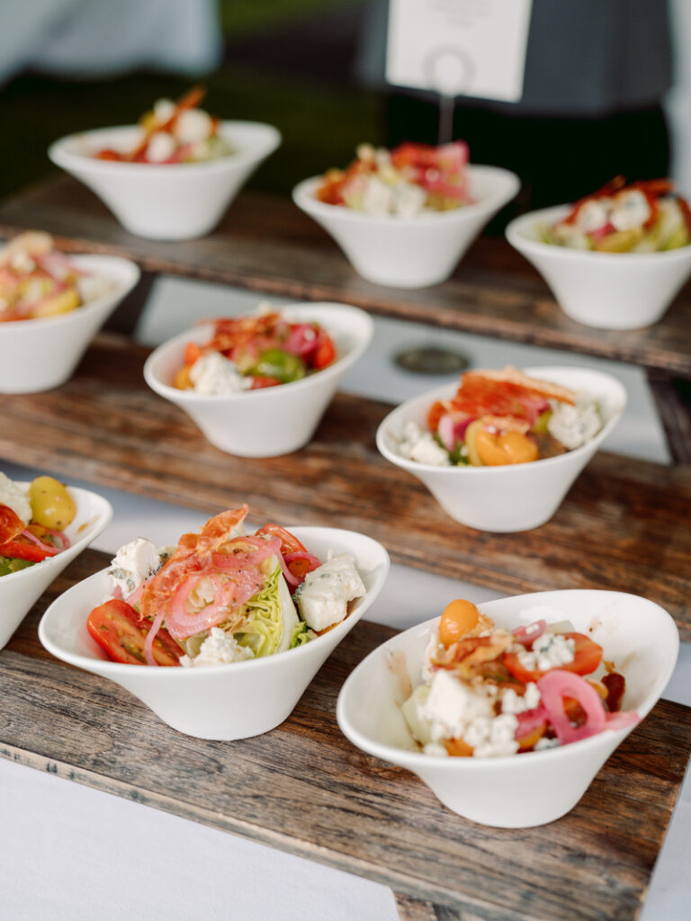 Plated wedding salads styled through full-service wedding planning with fresh, seasonal ingredients.